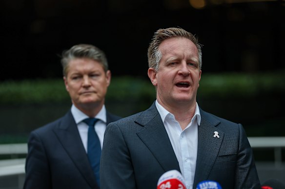 Emergency Services Minister Paul Edbrooke (right). 