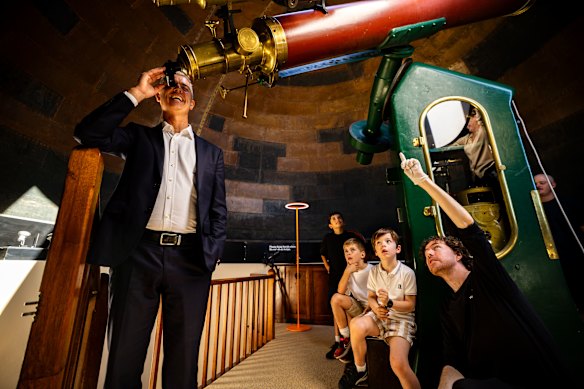 NSW Arts Minister John Graham with Sydney Observatory host Richard Stevenson and teenagers Rufus Poisel, Leo Messiah and Arlo Radic. 
