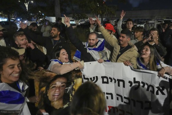 Israelis celebrate the release of three hostages who had been held captive by Hamas in Gaza as they gather in Tel Aviv, Israel.