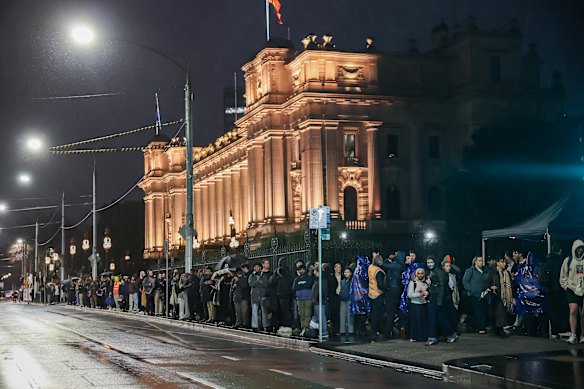 People queue for replacement buses.  