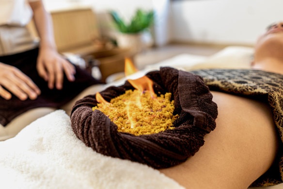 Getting fired up with Ya Pao, a traditional Thai therapy.