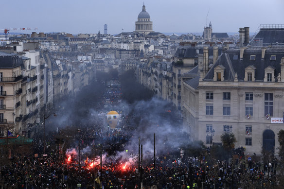 Protesters march, with the Pantheon monument in background, during a demonstration in Paris. 