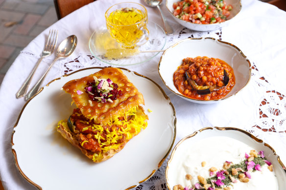 Tahdig sandwiches come filled with stew, perhaps mirza ghasemi (eggplant and tomato), plus an extra portion on the side.