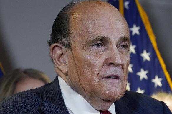 Donald Trump's personal lawyer Rudy Giuliani fronted the media with hair dye dripping down his face.