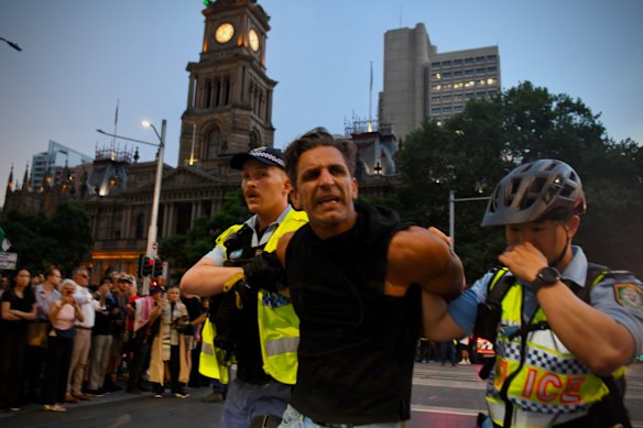 Protesters were marched into police vehicles.