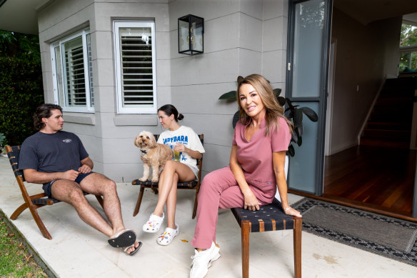 Bronwyn Roberts with her daughter Grace and Grace’s boyfriend, Mitch at her North Turramurra home before she downsizes.
