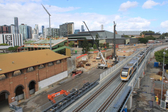 A train makes its way through the construction site at the Brisbane Showgrounds. 