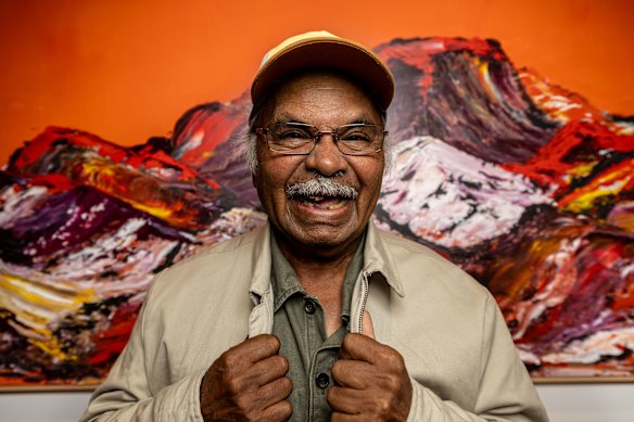 Artist and arts centre board member George Cooley with one of his works.