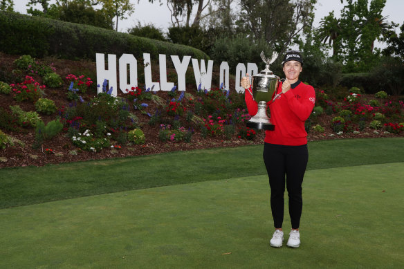 Hannah Green with the JM Eagle LA Championship trophy in California.