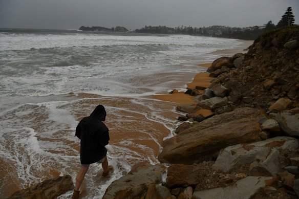 The bases of evacuated houses between Wamberal and Terrigal beaches have been battered again today the coastal low.