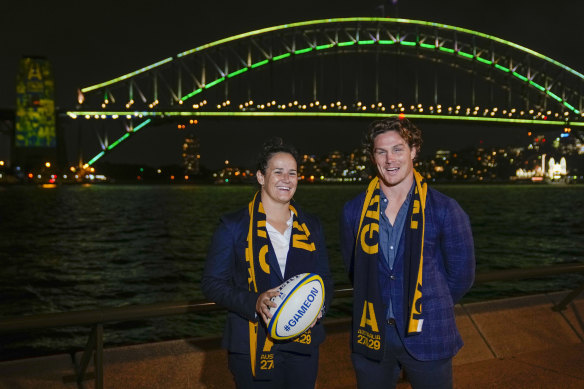 Wallabies captain Michael Hooper stands with Wallaroos captain Shannon Parry ahead of the final vote for the hosting of the Rugby World Cups in Sydney, Australia.