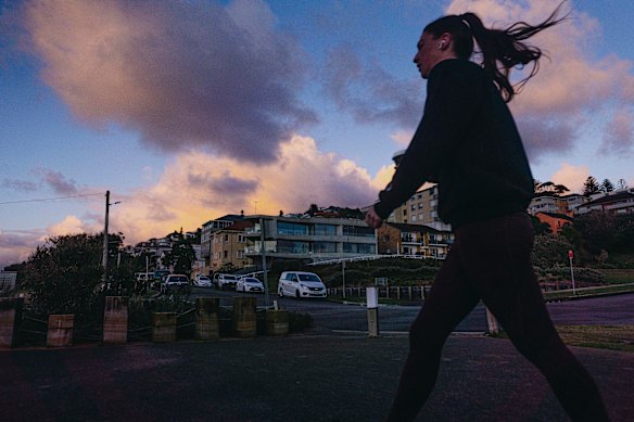 People out and about during sunrise at the South Coogee cliffs. 