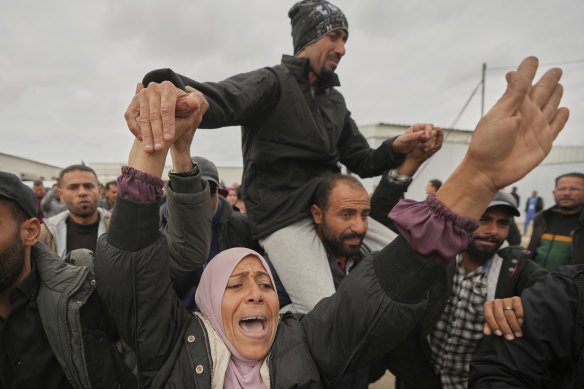 Freed Palestinian prisoners are greeted by a crowd as they arrive in the Gaza Strip after their release from an Israeli prison on Saturday.