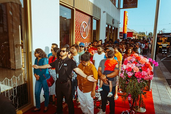 Customers queue to enter Malabar Gold and Diamonds at the store’s 2024 grand opening at Harris Park.