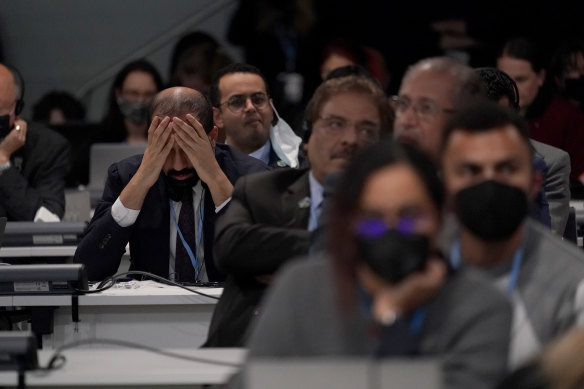 A delegate shakes his head during the negotiations. 