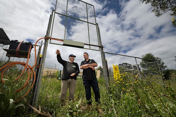 Cattle farmer David Trigg and deer removal specialist Emanuel Vlamis in the  trap.