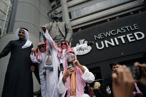 Newcastle United fans celebrate  after the Saudi Arabia-backed takeover of the club.
