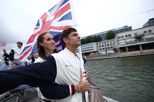 Britain’s flagbearers Tom Daley and Helen Glover recreate an iconic scene from Titanic on the River Seine.