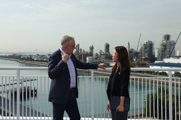 Anthony Albanese is shown an overview of Jurong Island operations by JTC Corp assistant chief Christine Wong.