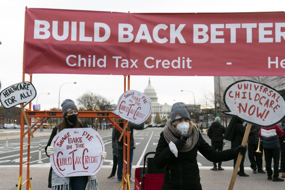 Demonstrators, asking congress to pass President Joe Biden’s “Build Back Better” agenda, block Pennsylvania Avenue during rush hour outside on Capitol Hill in Washington on December 7. 