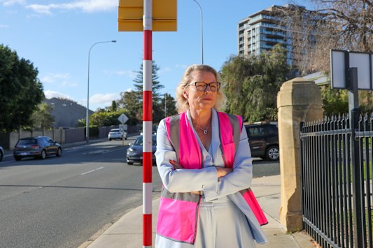 Presbyterian Ladies’ College Perth principal Cate Begbie takes on the role of traffic warden to help keep students safe.