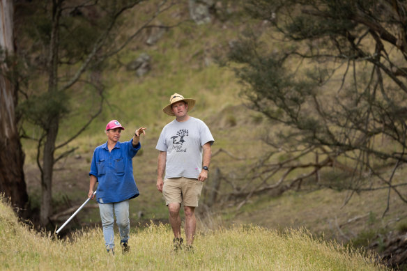 Farmer Jo and Roger MacRaild observing damage from wild pigs.