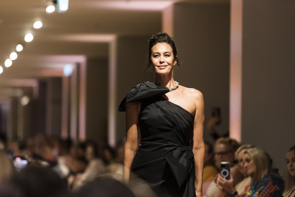 Return to runway: Megan Gale walking in the David Jones Autumn Winter 2023 runway in the Rachel Gilbert dress donated to the Powerhouse.