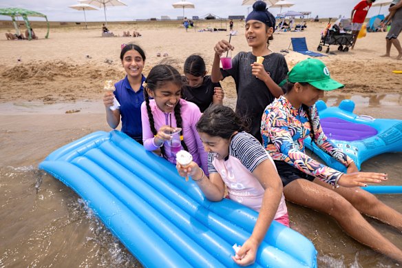 Members of the Singh, Boparai and Hoju families at Penrith Beach.