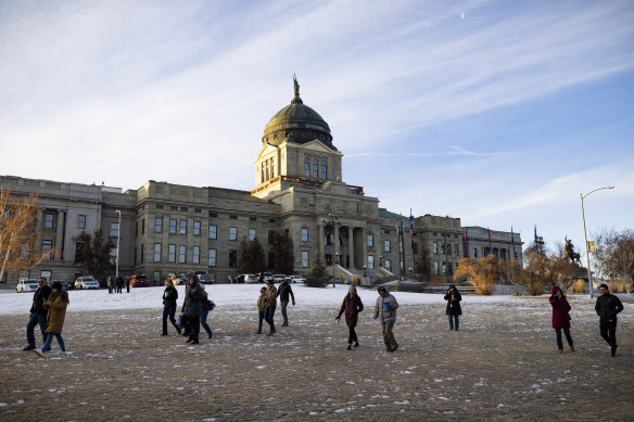 Staff evacuate from the Montana State Capitol.