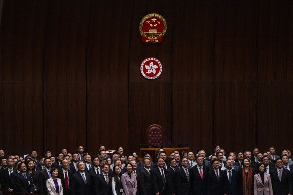 Politicians in Hong Kong pose for photographs after passing Article 23.