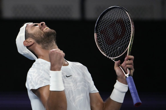 Karen Khachanov celebrates after defeating American Frances Tiafoe on Friday night.