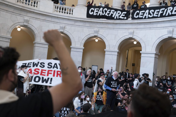 Demonstrators protest inside the Cannon House Office Building on Capitol Hill in Washington on Wednesday.