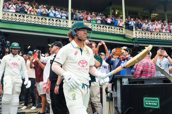 David Warner walks onto the SCG at the end of day one.