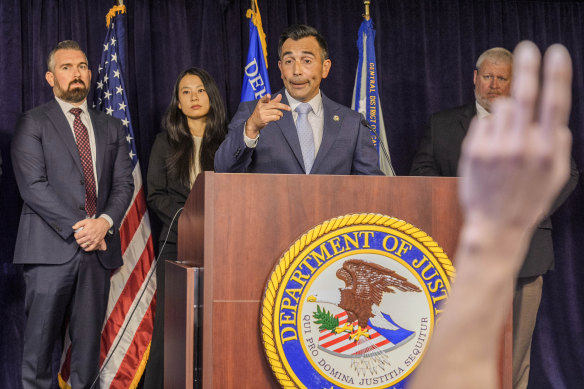 US Attorney Martin Estrada (centre) takes questions at a press conference in Los Angeles on Thursday.