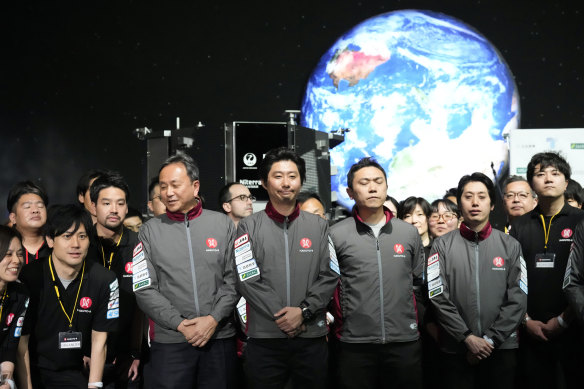 Takeshi Hakamada, centre, founder and chief executive of ispace and his team.