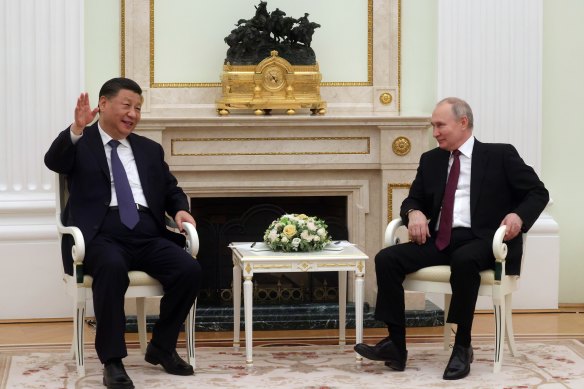 Chinese President Xi Jinping (left) meets with Russian President Vladimir at the Kremlin on Monday.
