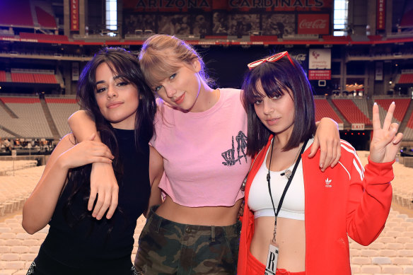 Camila Cabello, Taylor Swift, and Charli XCX onstage before opening night of Swift’s 2018 Reputation Stadium Tour in May 2018 in Arizona.
