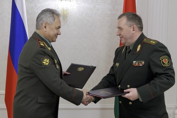 Russian Defence Minister Sergei Shoigu (left) and his Belarusian counterpart, Viktor Khrenin, meet in Minsk on Thursday.