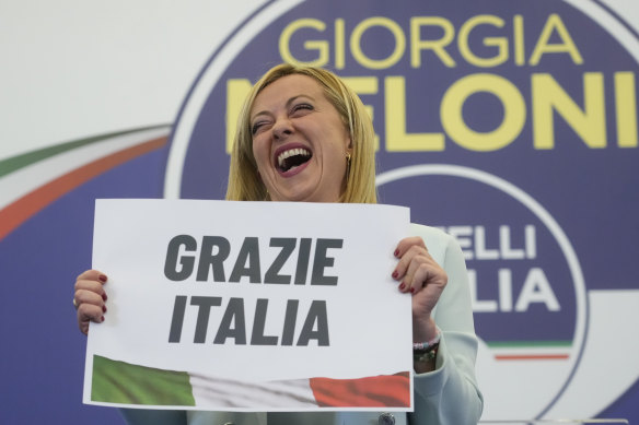 Giorgia Meloni, leader of the right-wing Brothers of Italy, holds a sign saying “Thanks Italy” as her party emerged victorious in Sunday’s election.