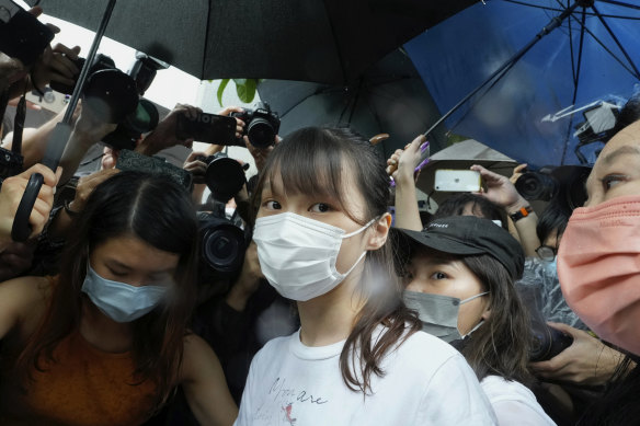 Agnes Chow, centre, was released on Saturday after serving seven months of a 10-month sentence. 