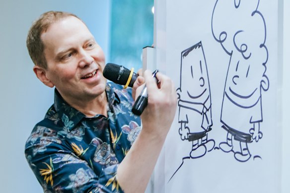 Pilkey drawing his Captain Underpants characters.
