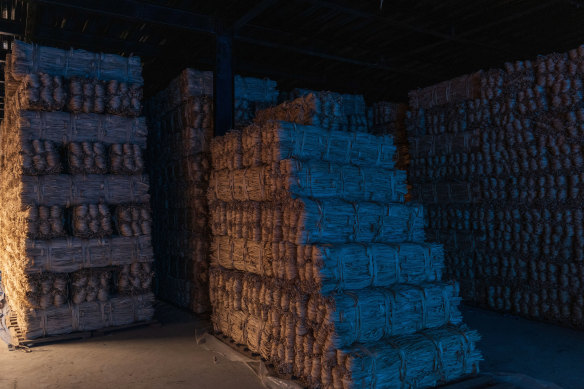 Bundles of argeli bark awaiting shipment to Japan are stored at a warehouse in Lalitpur, Nepal.