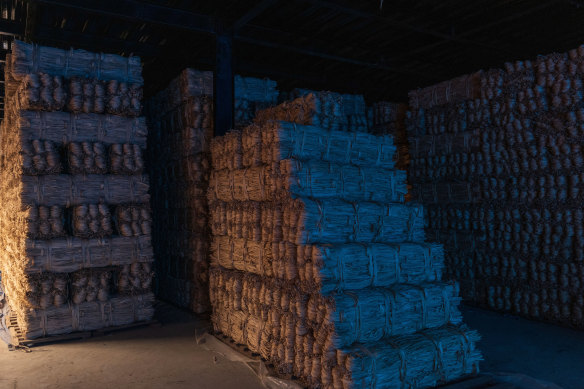 Bundles of argeli bark awaiting shipment to Japan are stored at a warehouse in Lalitpur, Nepal.