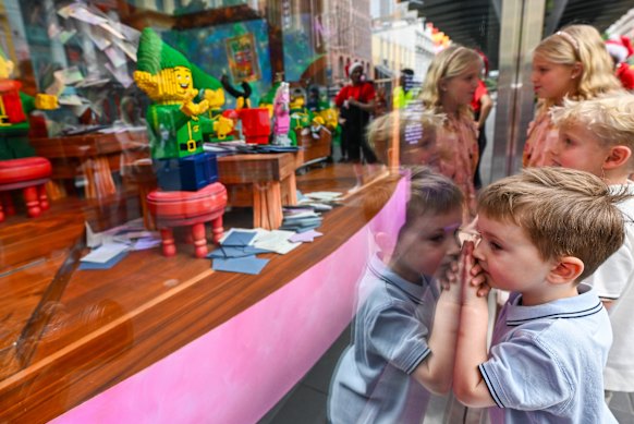 Sonny Baker, Hamish and Camilla McCombe at the unveiling of the Myer Christmas windows on Friday.