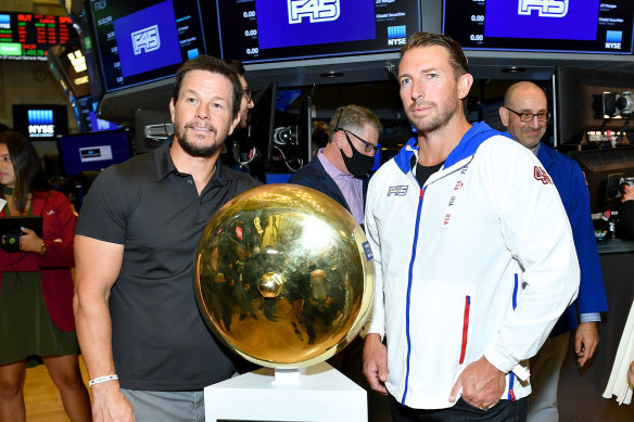F45 founder Adam Gilchrist and major shareholder Mark Wahlberg on the floor of the New York Stock Exchange for the company’s IPO in July 2021.