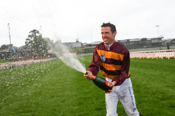 Jockey Johnny Allen celebrates his Cox Plate win.