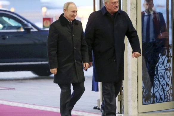 Russian President Vladimir Putin and Belarusian President Alexander Lukashenko arrive for their talks in Minsk.