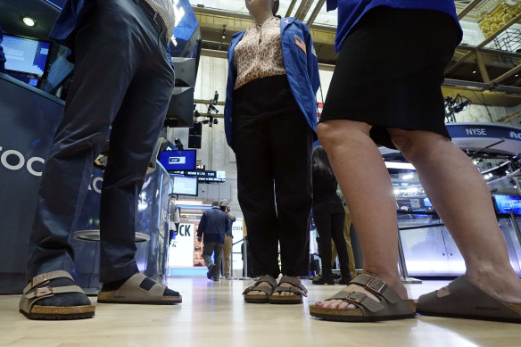 Traders on the floor of the New York Stock Exchange wear Birkenstock sandals during the company’s IPO.