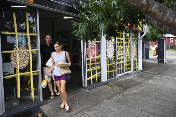 A shop in Greenslopes on Brisbane’s southside with tape, in a crisscross pattern, over the windows.