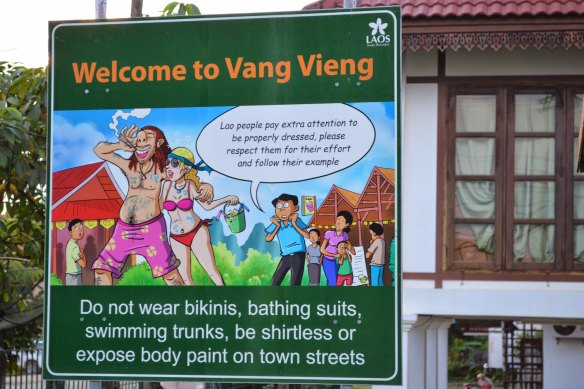 A street sign directed at tourists in the town of Vang Vieng, Laos. 